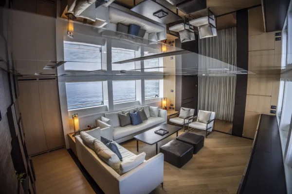Spacious and modern living area inside the Sanlorenzo SL96 yacht with high-end finishes for Costa Smeralda charters.
