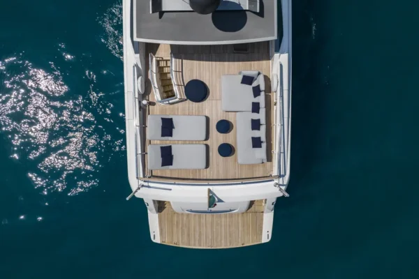 Top-down aerial perspective showing the flybridge layout and aft deck seating on the Sanlorenzo 96 in Sardinia.