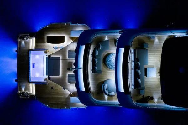 Aerial night shot of Benetti Oasis 40m decks showing outdoor lounges and lighting