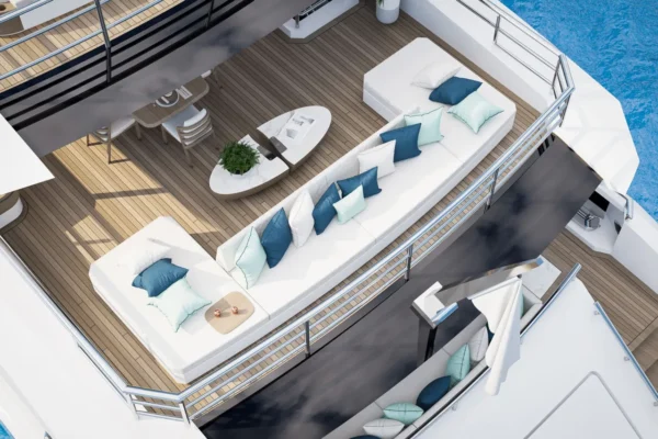 Top-down view of the spacious outdoor lounge and teal sofas on the Bilgin 163.