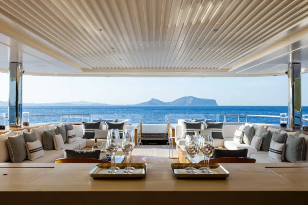 Upper deck outdoor dining area with ocean views on Rossinavi Alchemy