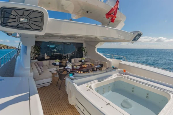 Jacuzzi and aft deck lounge on Mangusta 130 luxury yacht with sea view in Costa Smeralda, Sardinia