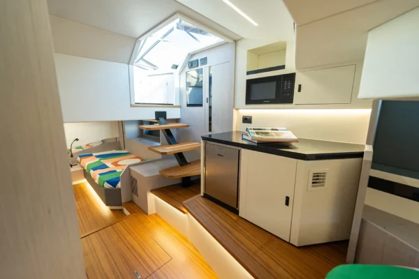View of the lower deck galley and steps leading to the cabins on the BB Yachts Panarea 44 in Porto Cervo, Costa Smeralda, Sardinia.