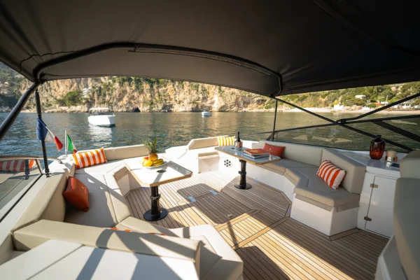 View from the helm station looking aft towards the dining area and stern of the BB Yachts Panarea 44 in Porto Cervo, Costa Smeralda, Sardinia.