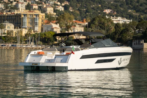 Rear view of a white BB Yachts Panarea 44 showing the teak swim platform and stern profile in the waters of Porto Cervo, Costa Smeralda, Sardinia.